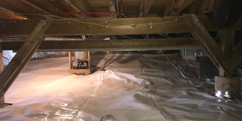 Finished crawlspace encapsulation showing clean vapor barrier and dry storage space